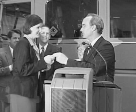 Suzanne Hobbs receiving the signing pen from Governor Dirk Kempthorne.