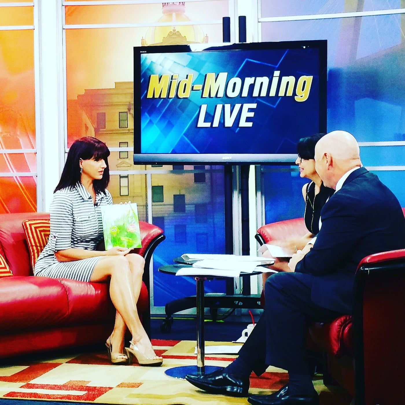 Suzanne Hobbs on the Mid-Morning Live set in Georgia, with the two other anchors.